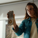 Lyra (Dafne Keen) shows the alethiometer at the center of it all.
